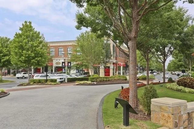 a view of a street with houses on both side