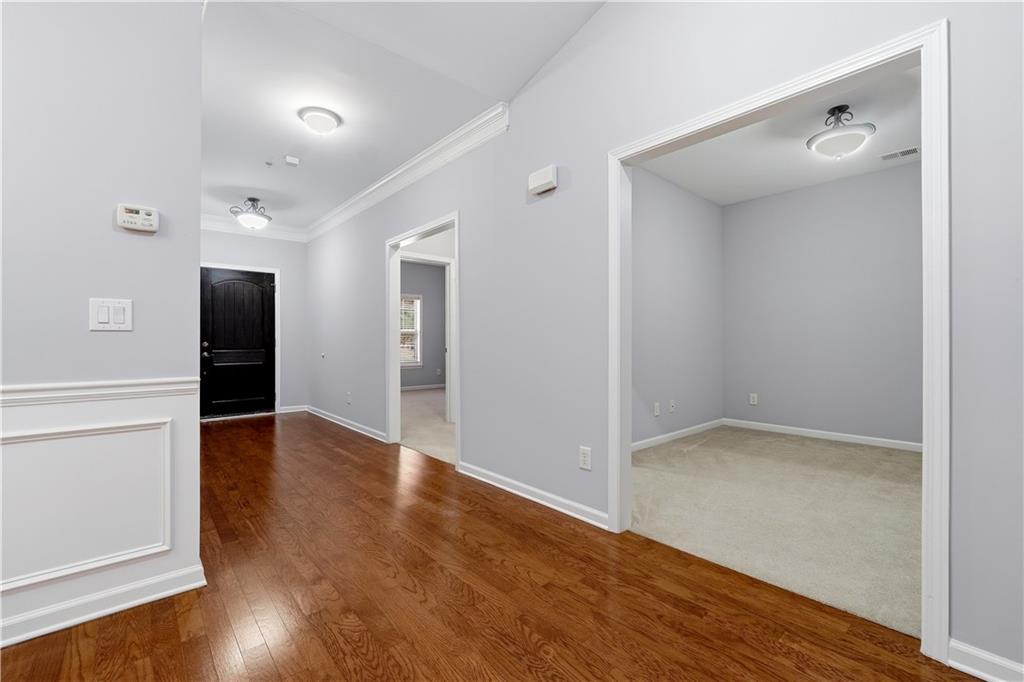 2310 Callaway Court Cumming, GA 30041 - Photo 3 of 30 wooden floor in an empty room with a window