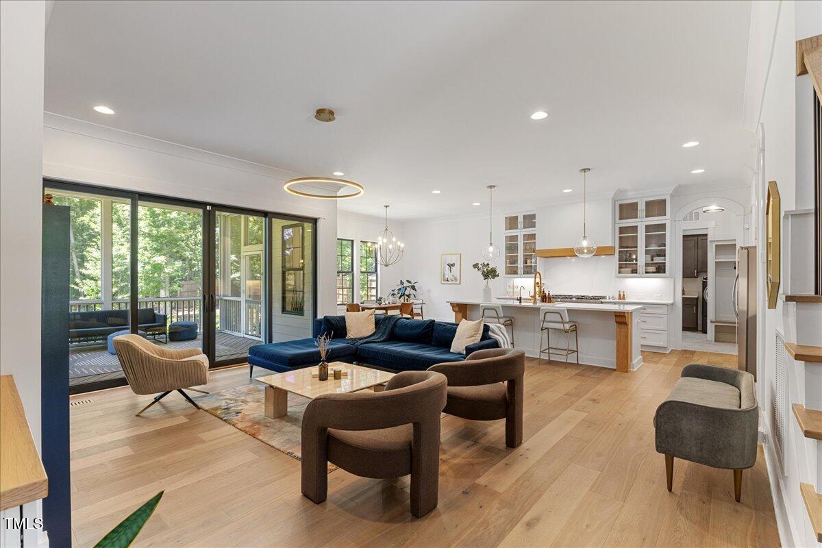 8420 Bells Lake Road Apex, NC 27539 - Photo 21 of 65 a living room with furniture and a large window