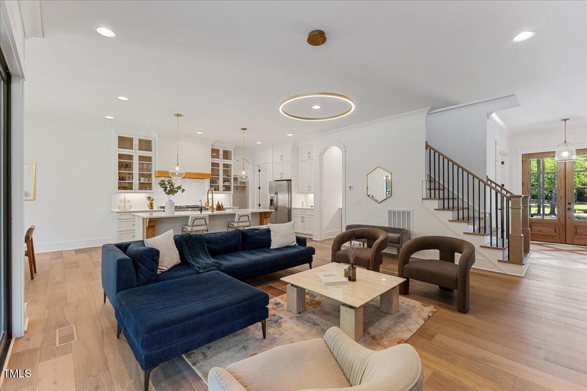 8420 Bells Lake Road Apex, NC 27539 - Photo 24 of 65 a living room with furniture and wooden floor