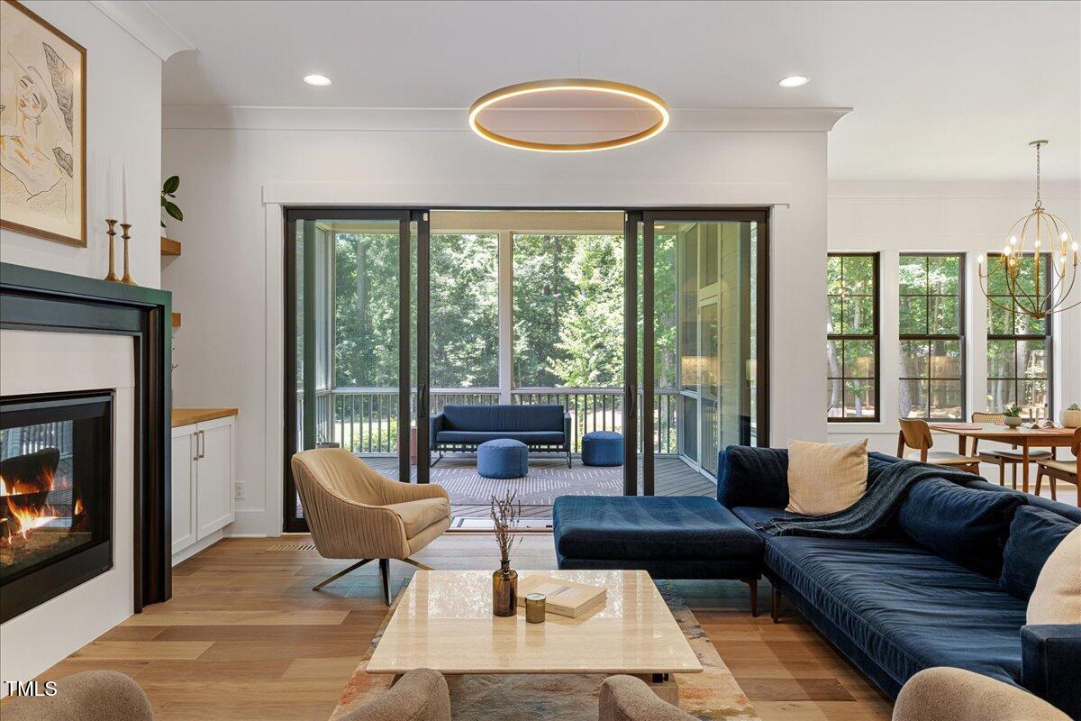 8420 Bells Lake Road Apex, NC 27539 - Photo 40 of 65 a living room with furniture and a fireplace