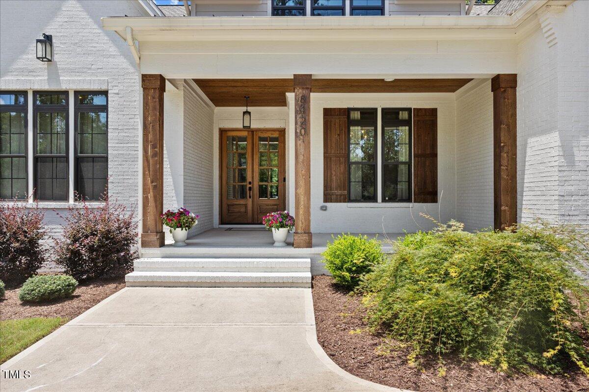 8420 Bells Lake Road Apex, NC 27539 - Photo 4 of 65 front view of of house with a yard