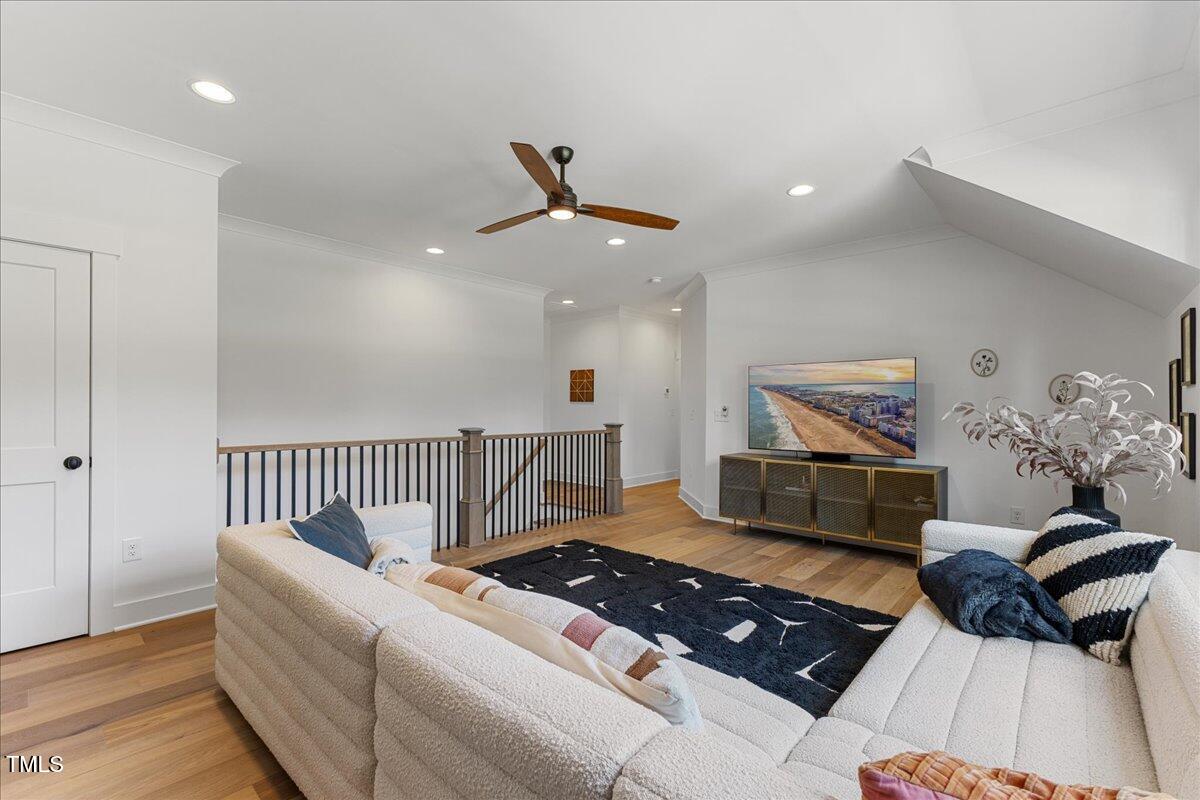 8420 Bells Lake Road Apex, NC 27539 - Photo 46 of 65 a living room with furniture and wooden floor