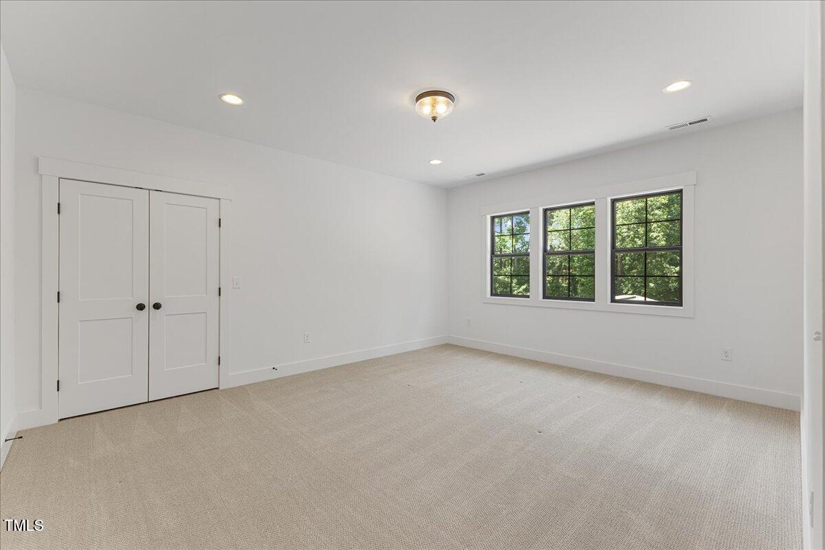 8420 Bells Lake Road Apex, NC 27539 - Photo 56 of 65 an empty room with windows