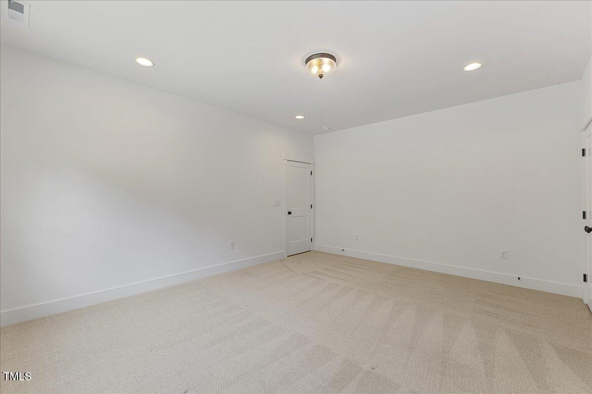 8420 Bells Lake Road Apex, NC 27539 - Photo 57 of 65 an empty room with an entryway