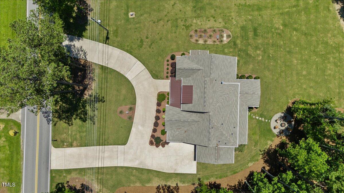 8420 Bells Lake Road Apex, NC 27539 - Photo 64 of 65 an aerial view of a house with a garden