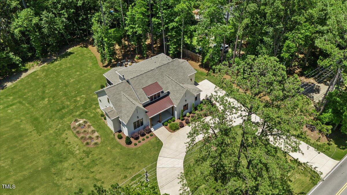 8420 Bells Lake Road Apex, NC 27539 - Photo 65 of 65 an aerial view of a house with a yard