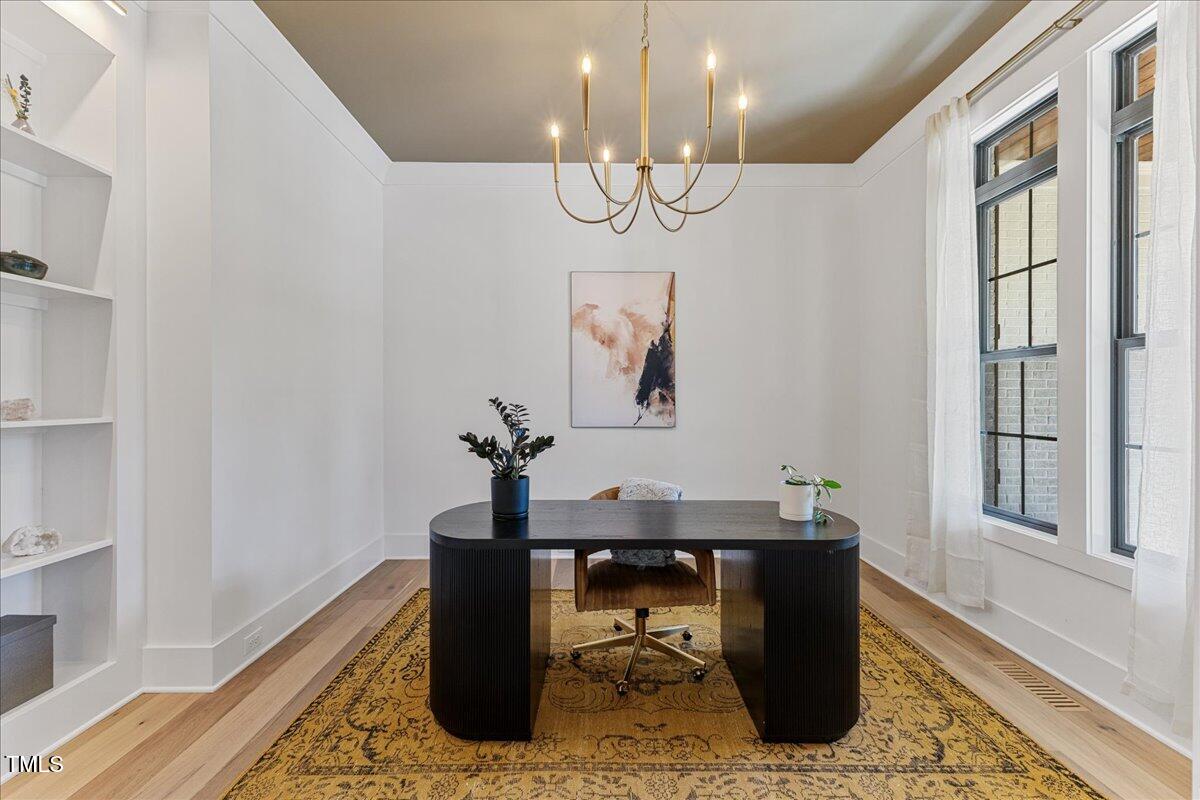 8420 Bells Lake Road Apex, NC 27539 - Photo 7 of 65 a view of a dining room with furniture