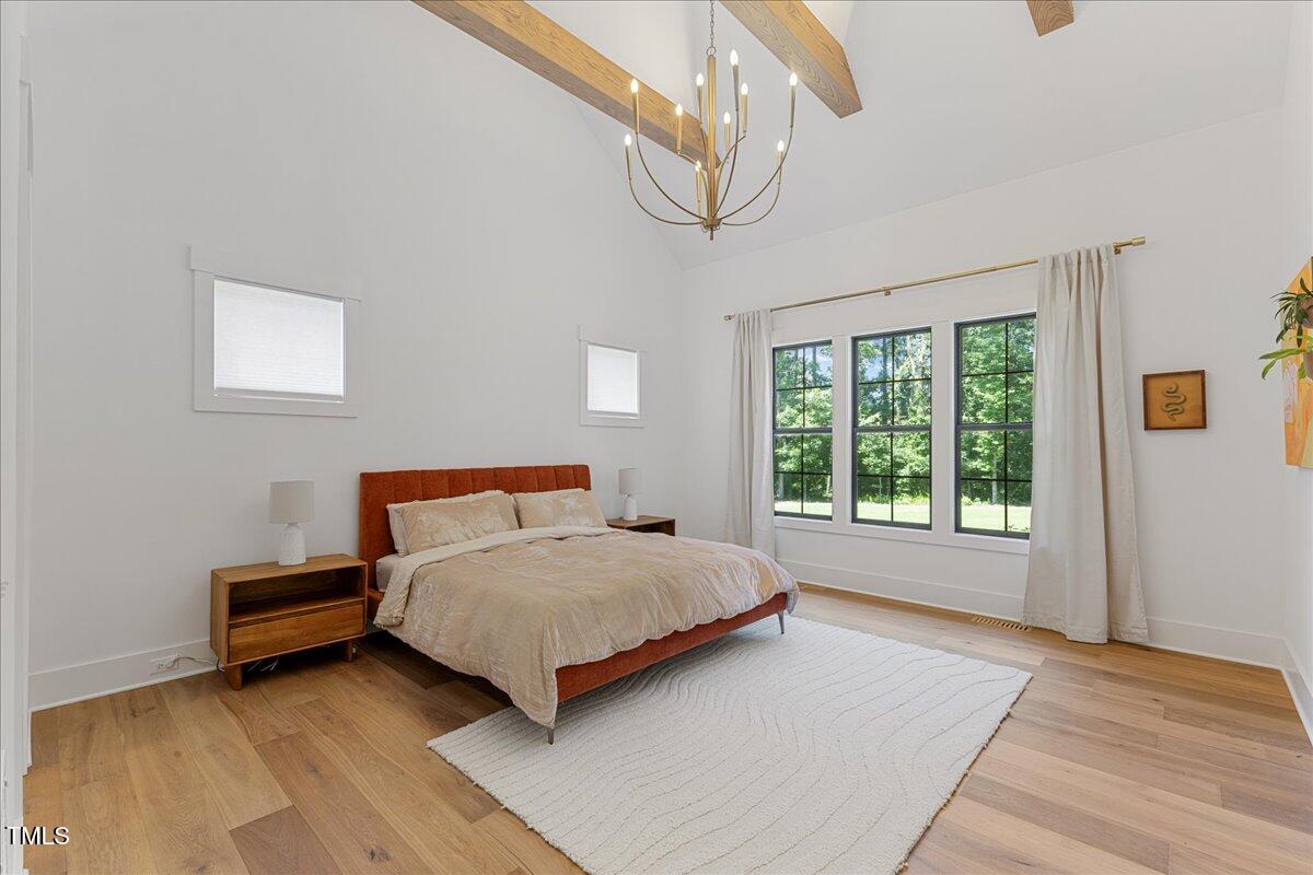 8420 Bells Lake Road Apex, NC 27539 - Photo 10 of 65 a bedroom with a bed and a window