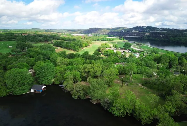 a view of a lake with a yard