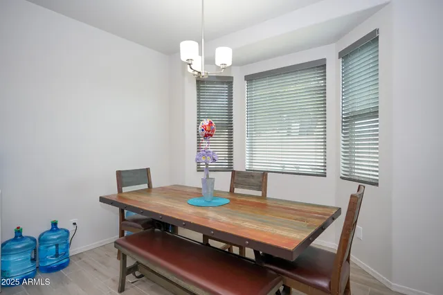 a hallway with a couch and a refrigerator