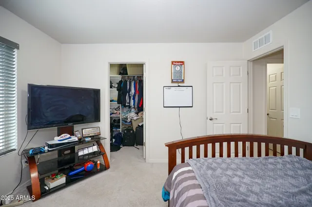 a bedroom with furniture and a window