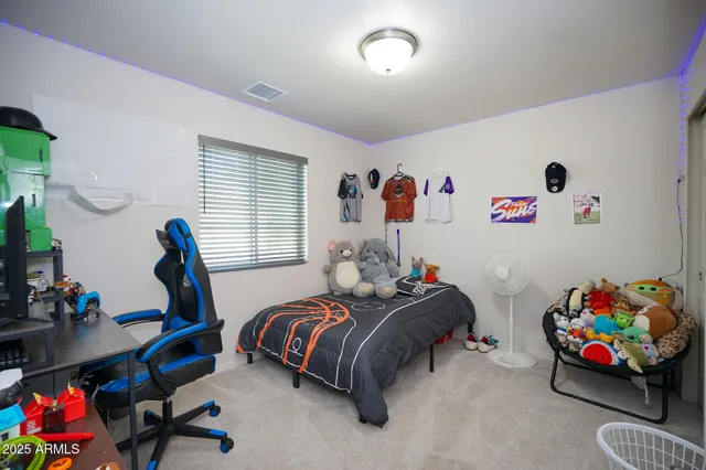 a bedroom with bed and a window