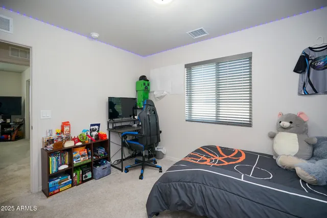 a bedroom with furniture and a window