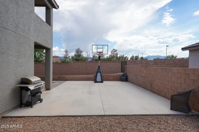 a swimming pool with outdoor seating and yard