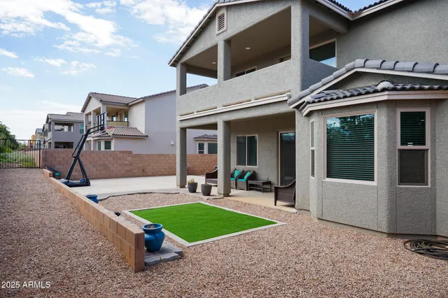 an aerial view of a house with a swimming pool