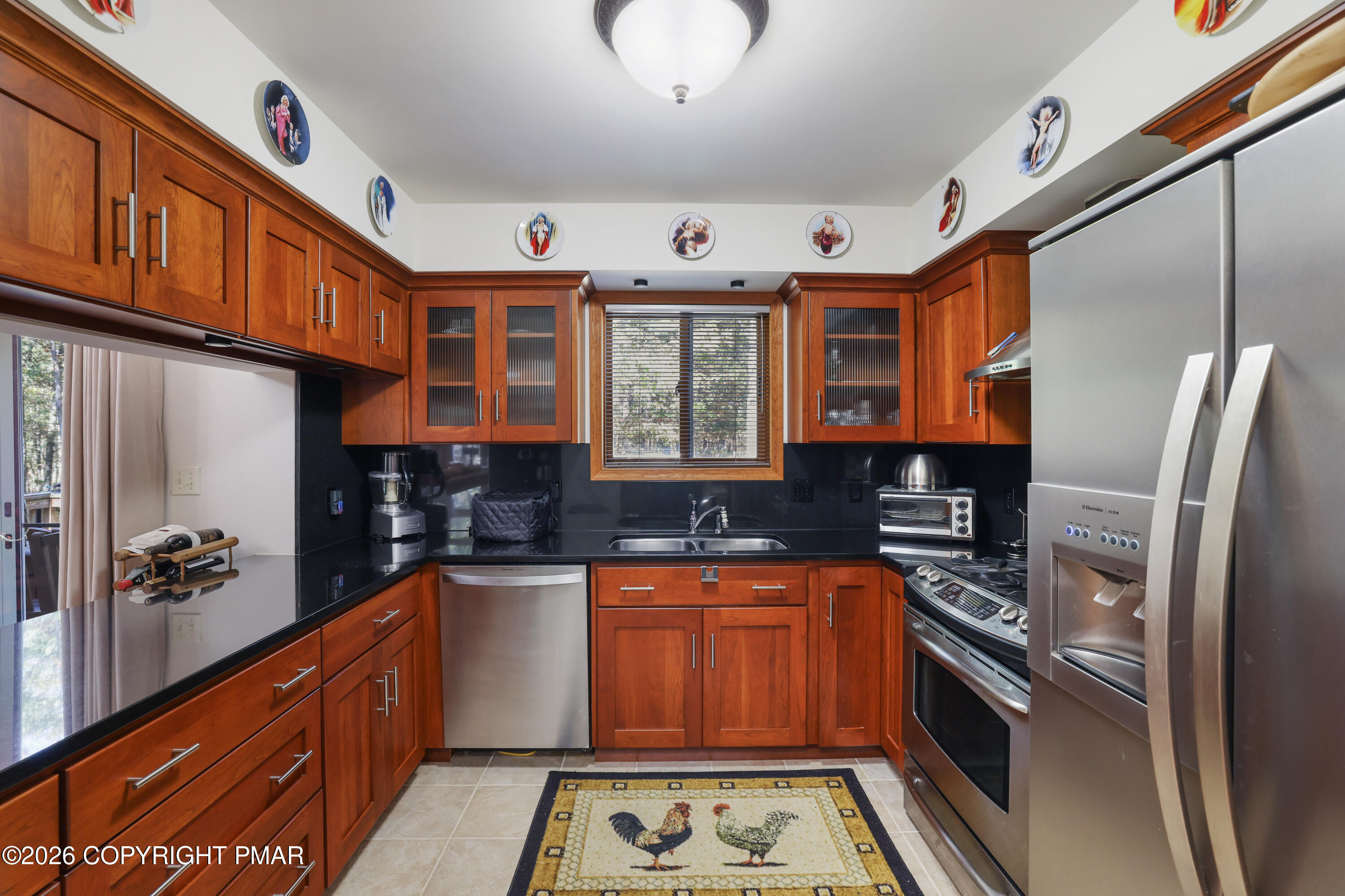 3176 Bluebird Drive Bushkill, PA 18324 - Photo 12 of 50 a kitchen with stainless steel appliances granite countertop a sink stove and cabinets