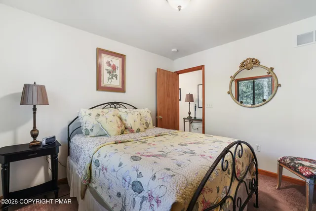 a bedroom with bed and a window