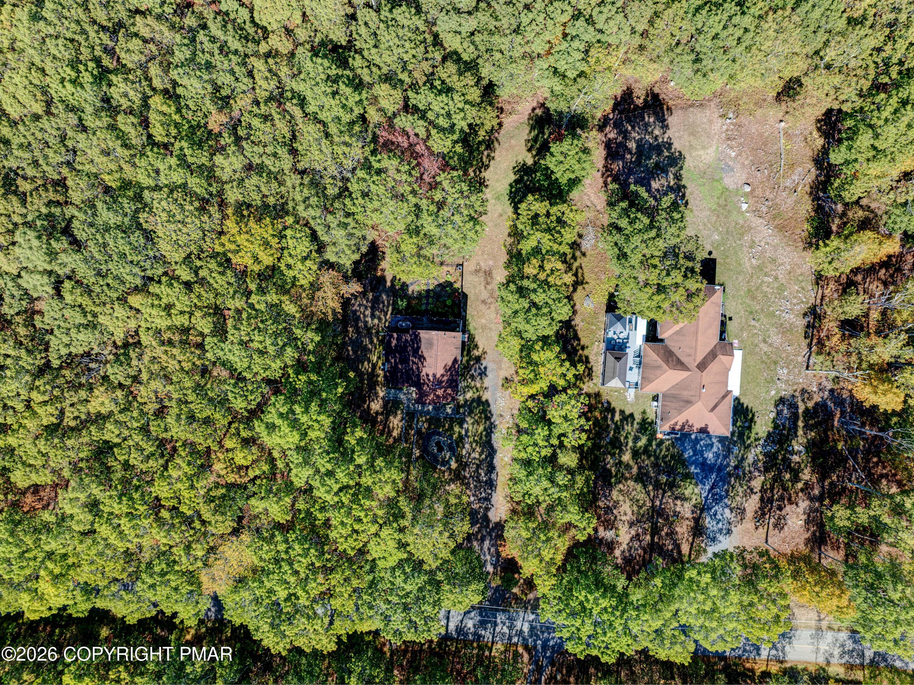 3176 Bluebird Drive Bushkill, PA 18324 - Photo 45 of 50 an aerial view of residential house with outdoor space and trees all around
