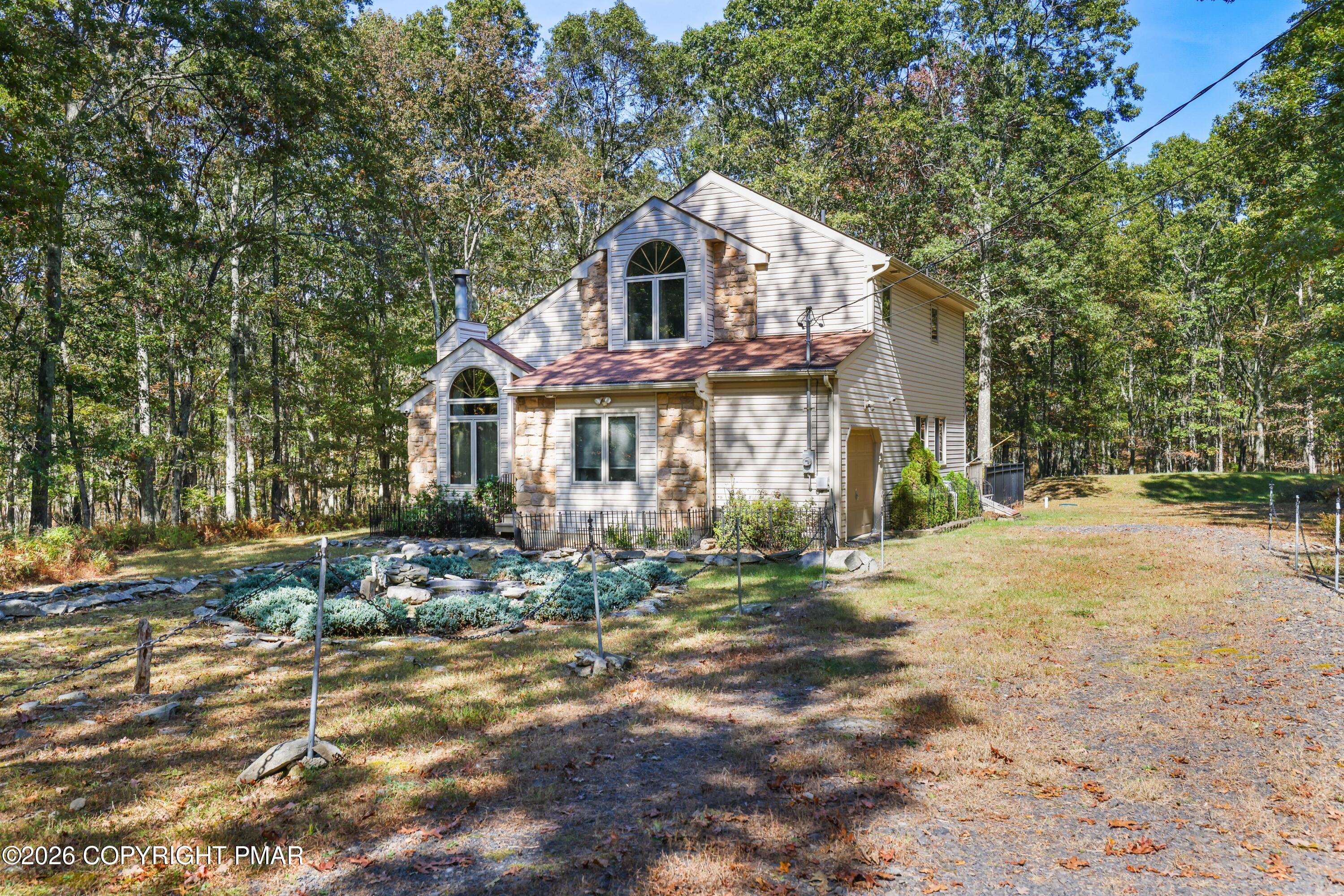 3176 Bluebird Drive Bushkill, PA 18324 - Photo 50 of 50 a front view of a house with a yard