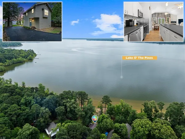 an aerial view of a house with lake view and a garden