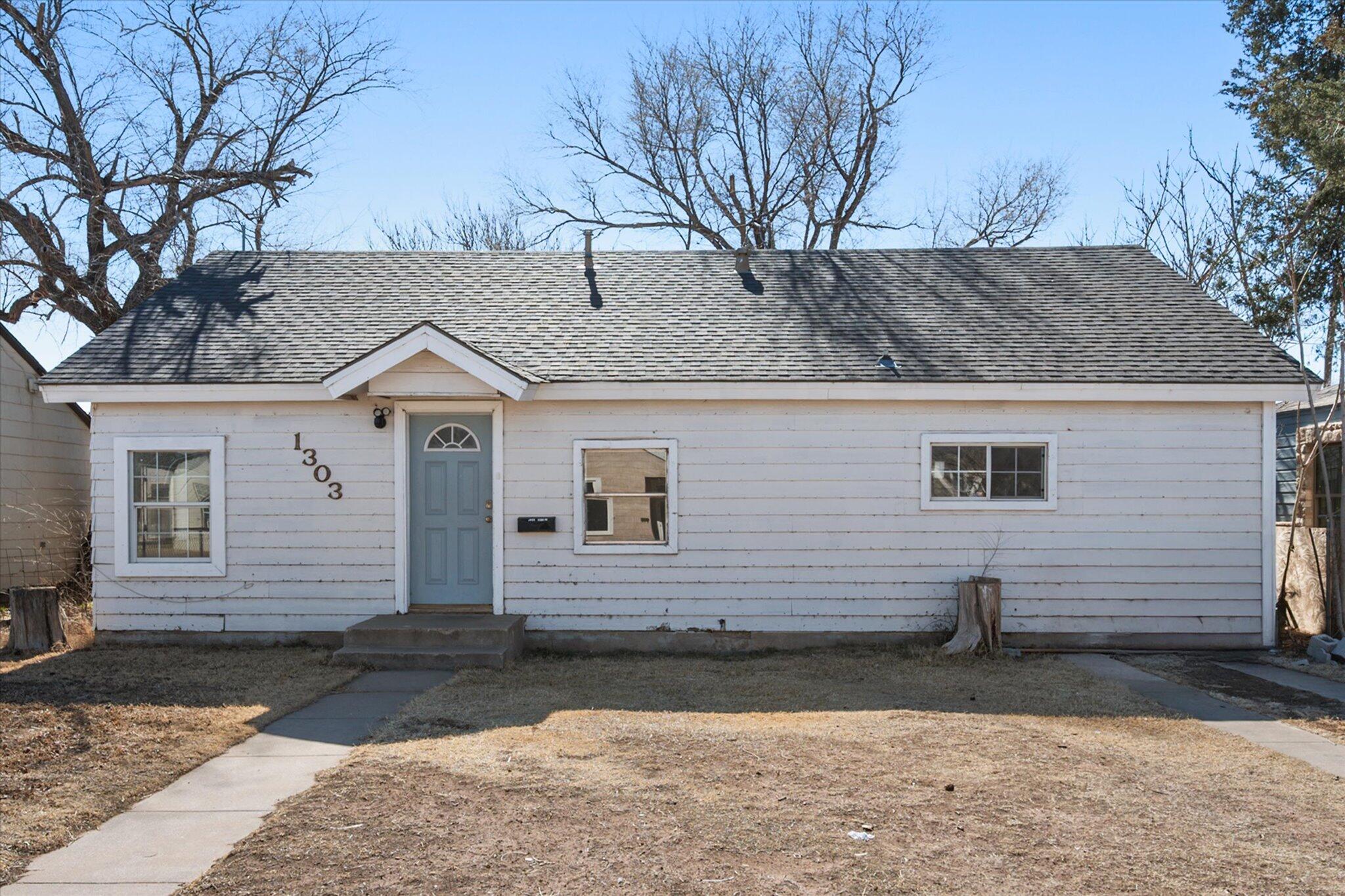 1303 28th Street Lubbock, TX 79411 - Photo 12 of 12 a view of a house with a yard