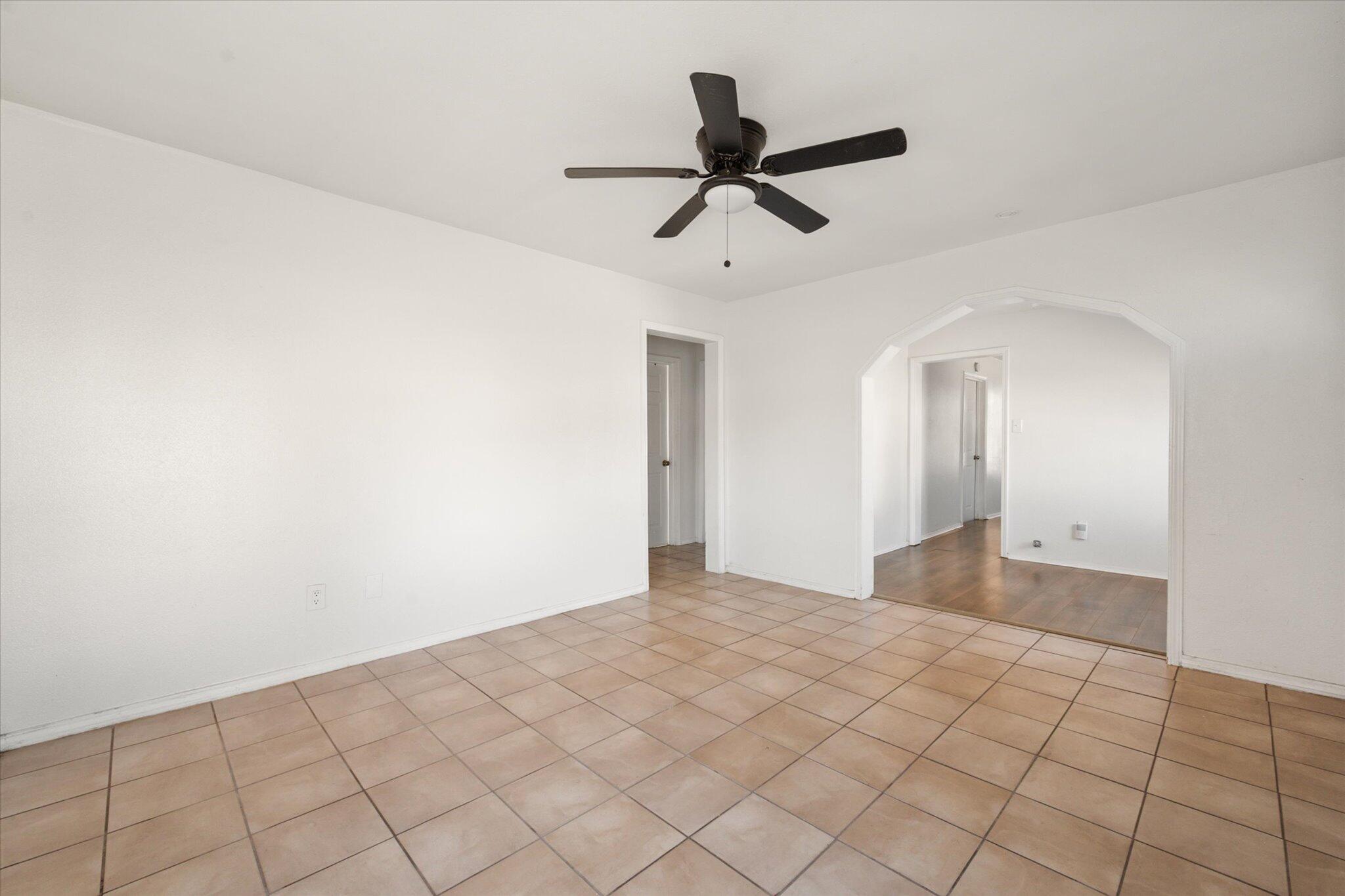 1303 28th Street Lubbock, TX 79411 - Photo 4 of 12 a view of a big room with closet and ceiling fan