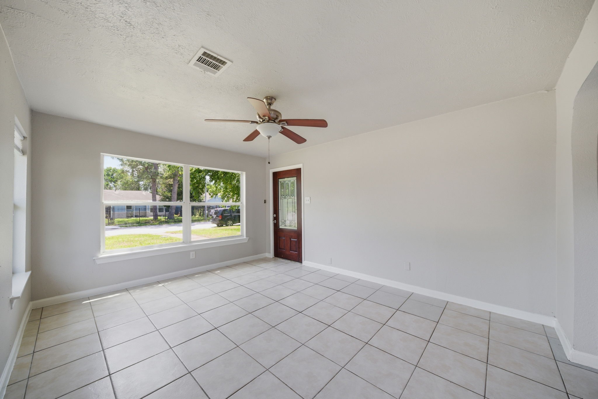 1102 Johnson Street Pasadena, TX 77506 - Photo 7 of 15 a view of an empty room with a window