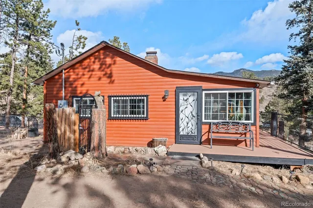a front view of house with outdoor seating