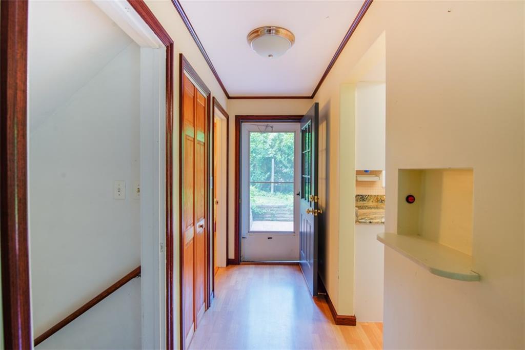115 Byron Road Pittsburgh, PA 15237 - Photo 5 of 23 Hardwood floors flow through the entryway leading to the living room. Both the powder room and kitchen are accessible from either side.