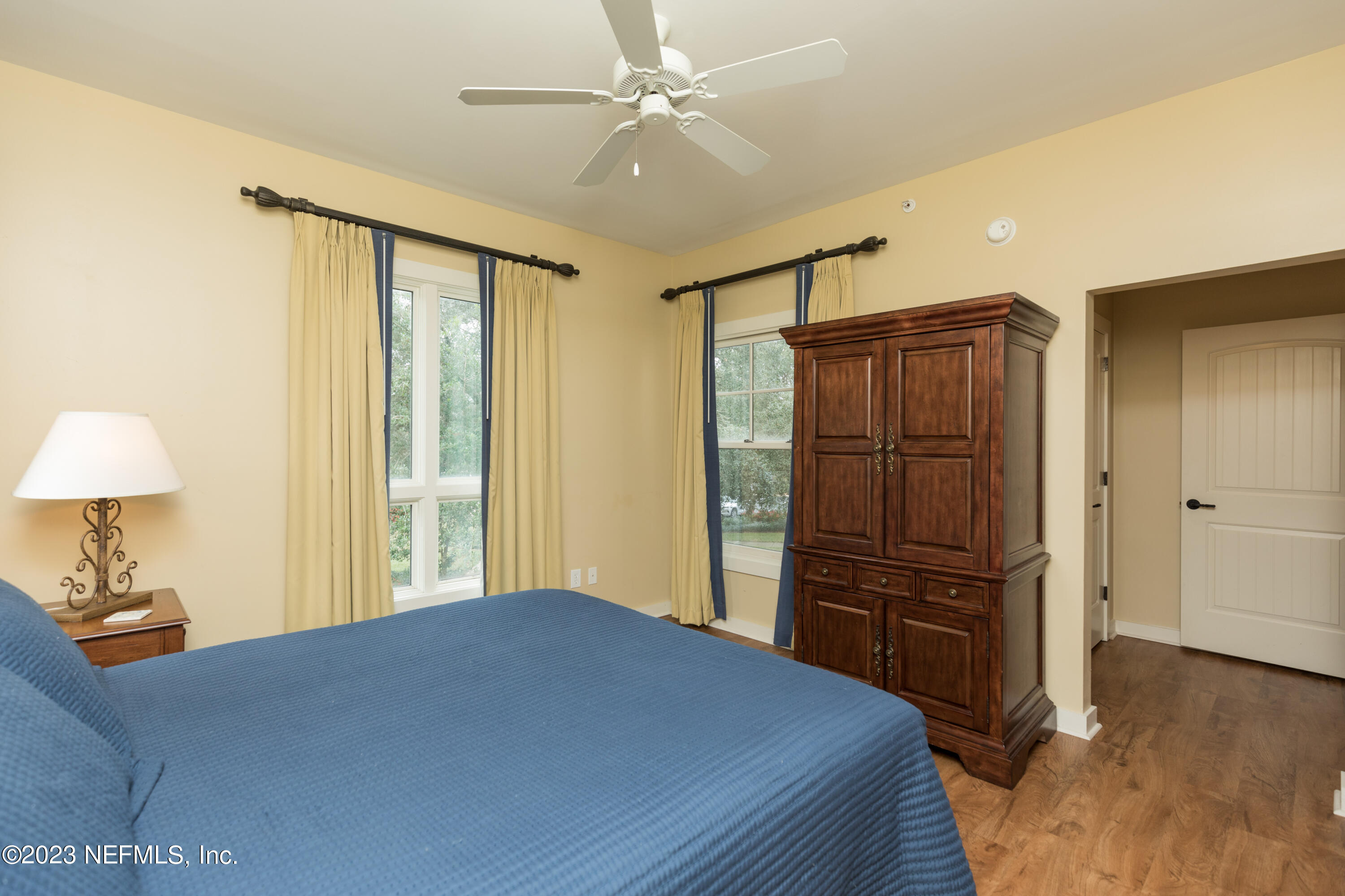 945 Registry Boulevard, Unit 201 St. Augustine, FL 32092 - Photo 17 of 65 a bedroom with a bed dresser and a window