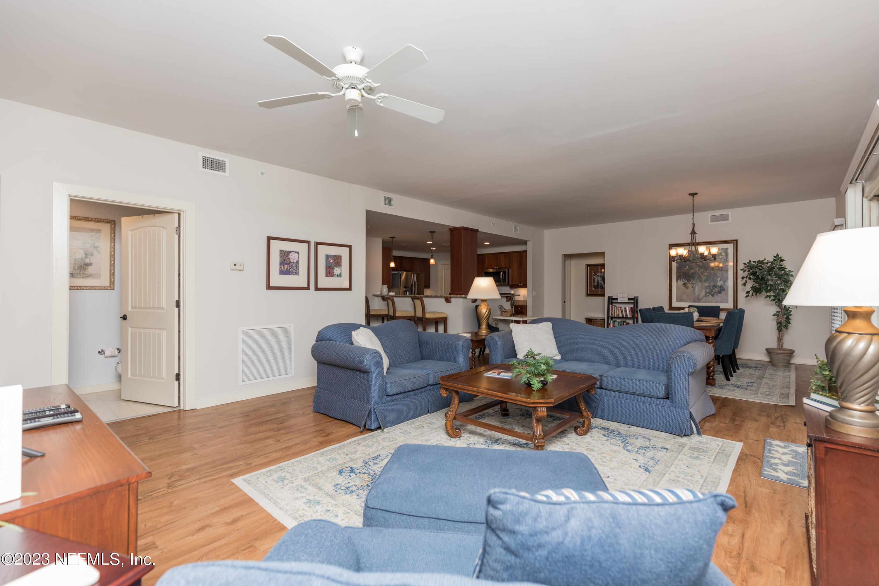 945 Registry Boulevard, Unit 201 St. Augustine, FL 32092 - Photo 29 of 65 a living room with furniture and wooden floor