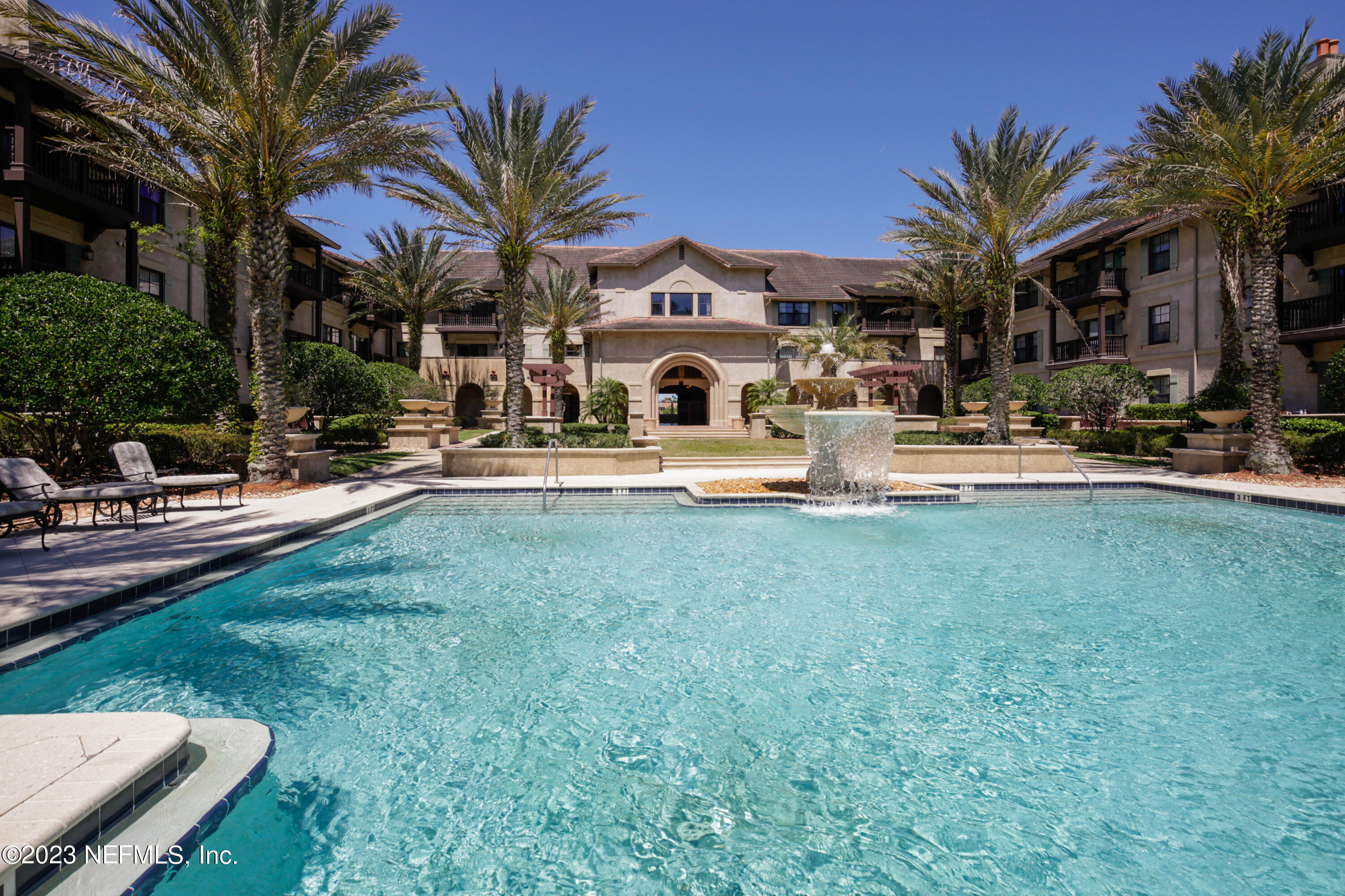 945 Registry Boulevard, Unit 201 St. Augustine, FL 32092 - Photo 5 of 65 a view of a house with a swimming pool and sitting area