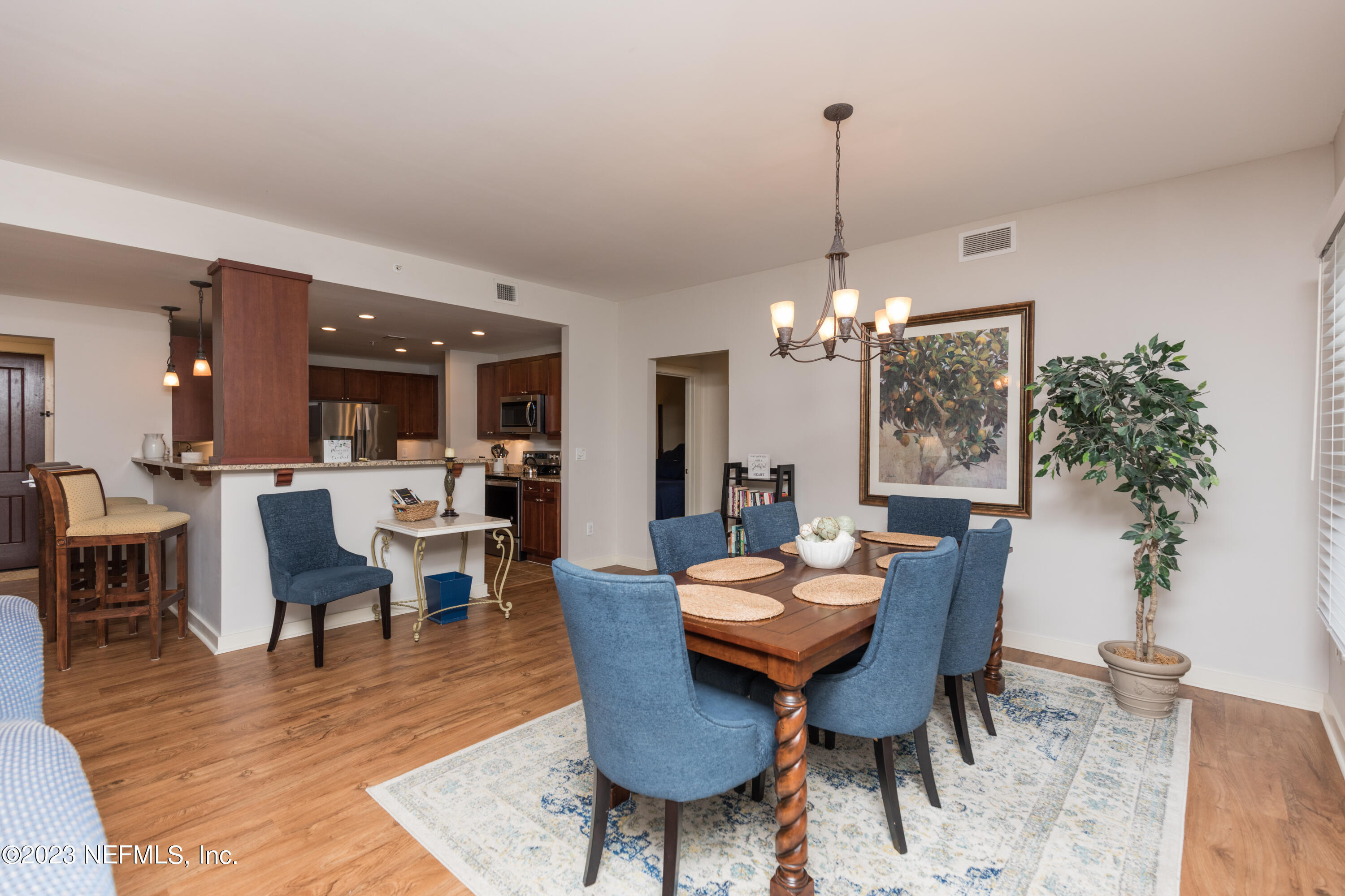 945 Registry Boulevard, Unit 201 St. Augustine, FL 32092 - Photo 53 of 65 a view of a dining room with furniture window and wooden floor