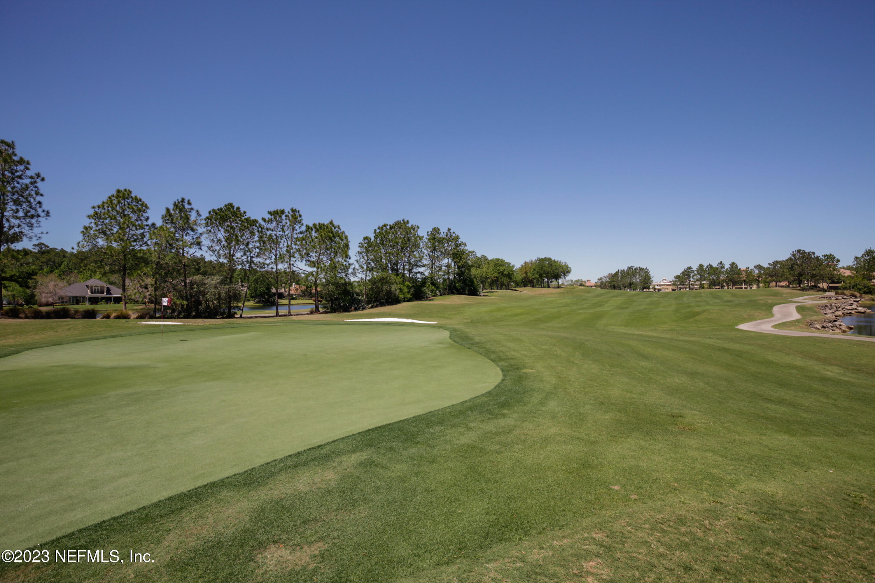 945 Registry Boulevard, Unit 201 St. Augustine, FL 32092 - Photo 59 of 65 a view of a field with houses in background