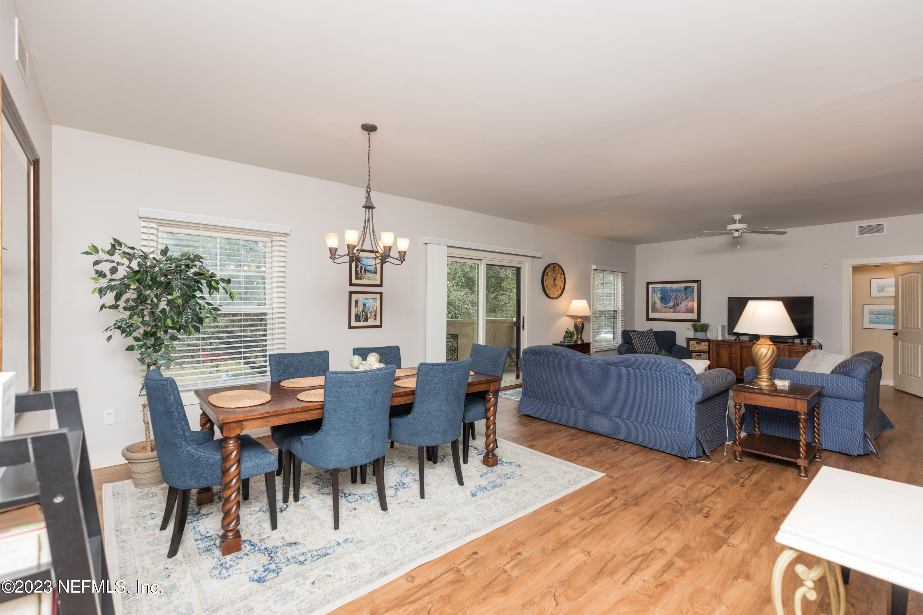 945 Registry Boulevard, Unit 201 St. Augustine, FL 32092 - Photo 65 of 65 a view of a dining room with furniture window and wooden floor