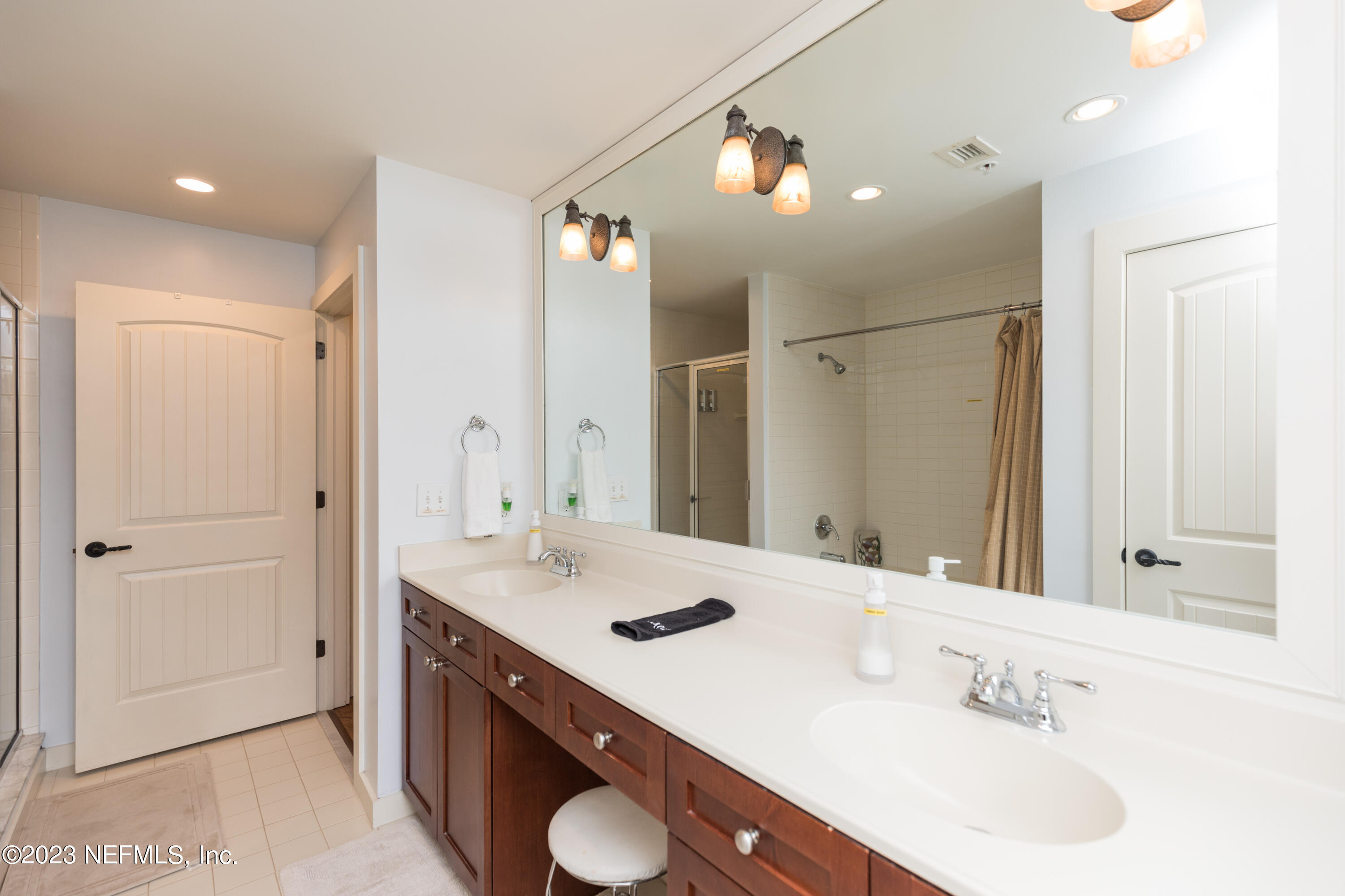 945 Registry Boulevard, Unit 201 St. Augustine, FL 32092 - Photo 8 of 65 a bathroom with a sink double vanity and a mirror