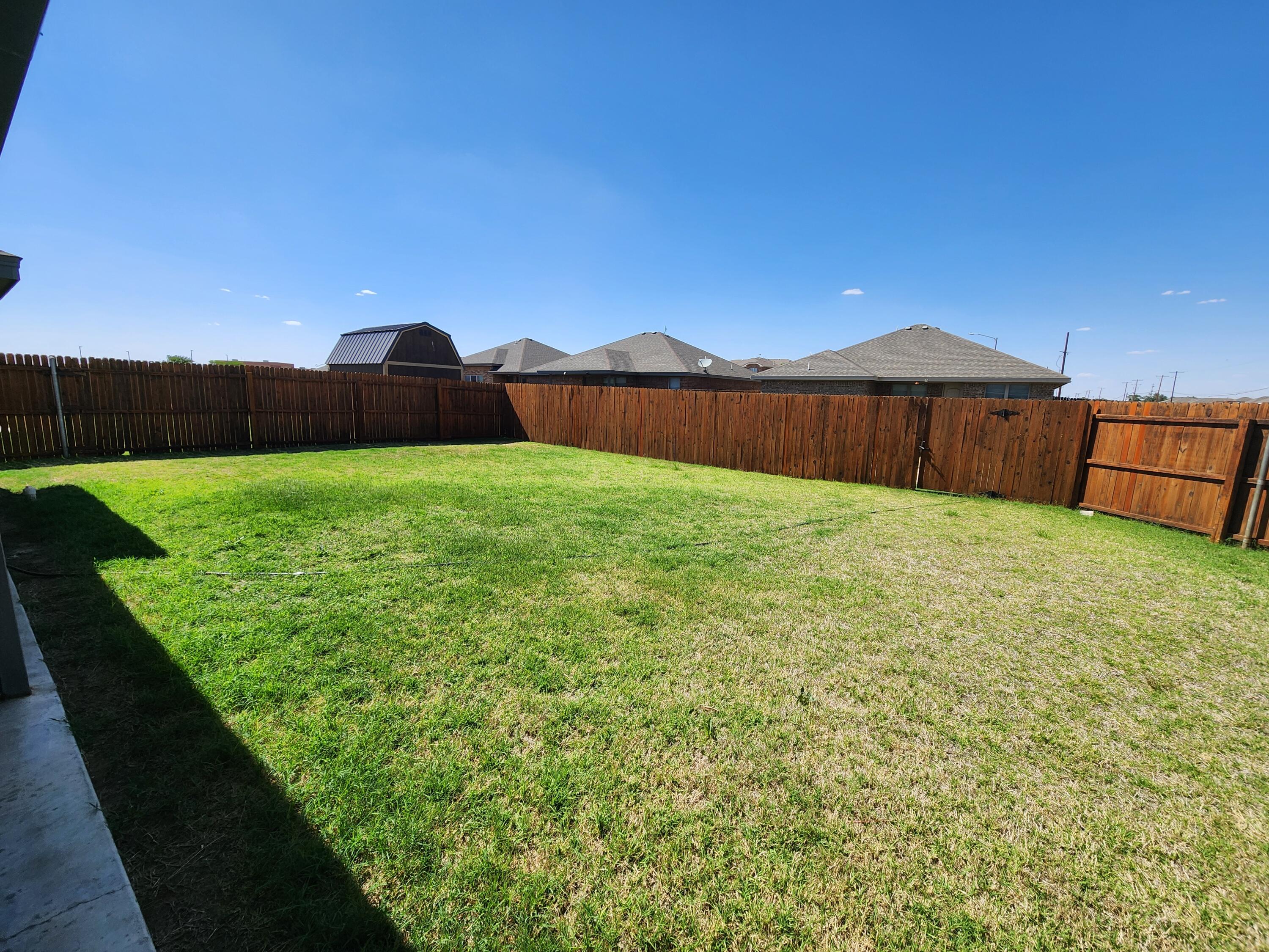 8702 13th Street Lubbock, TX 79416 - Photo 25 of 25 a view of a back yard