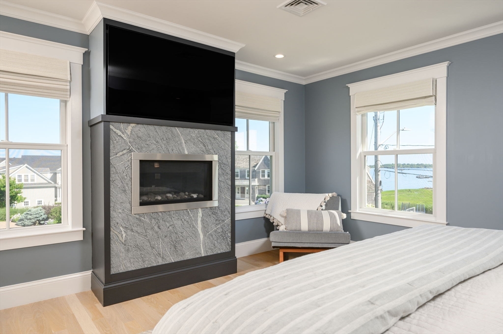 34 Highview Drive Hingham, MA 02043 - Photo 22 of 40 a bedroom with a bed and a flat screen tv