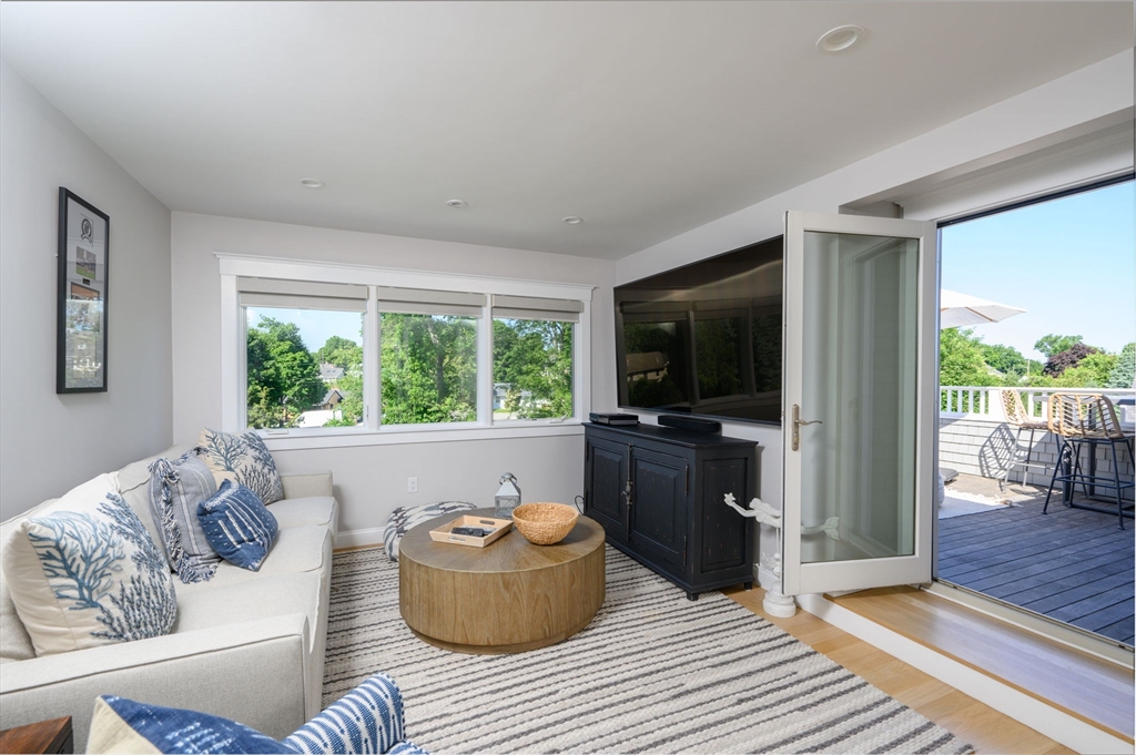 34 Highview Drive Hingham, MA 02043 - Photo 28 of 40 a living room with furniture and a flat screen tv