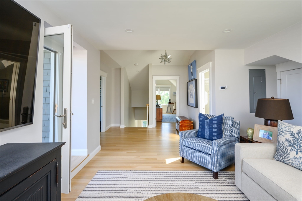 34 Highview Drive Hingham, MA 02043 - Photo 33 of 40 a living room with furniture and a wooden floor
