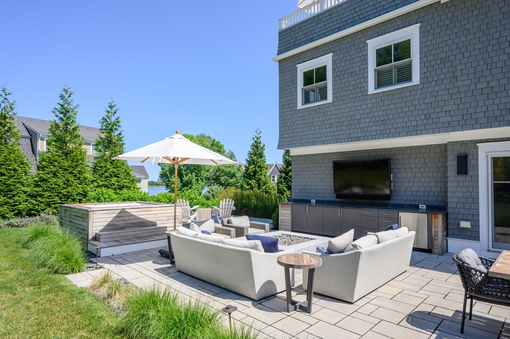 34 Highview Drive Hingham, MA 02043 - Photo 34 of 40 a building outdoor space with patio couch and potted plants