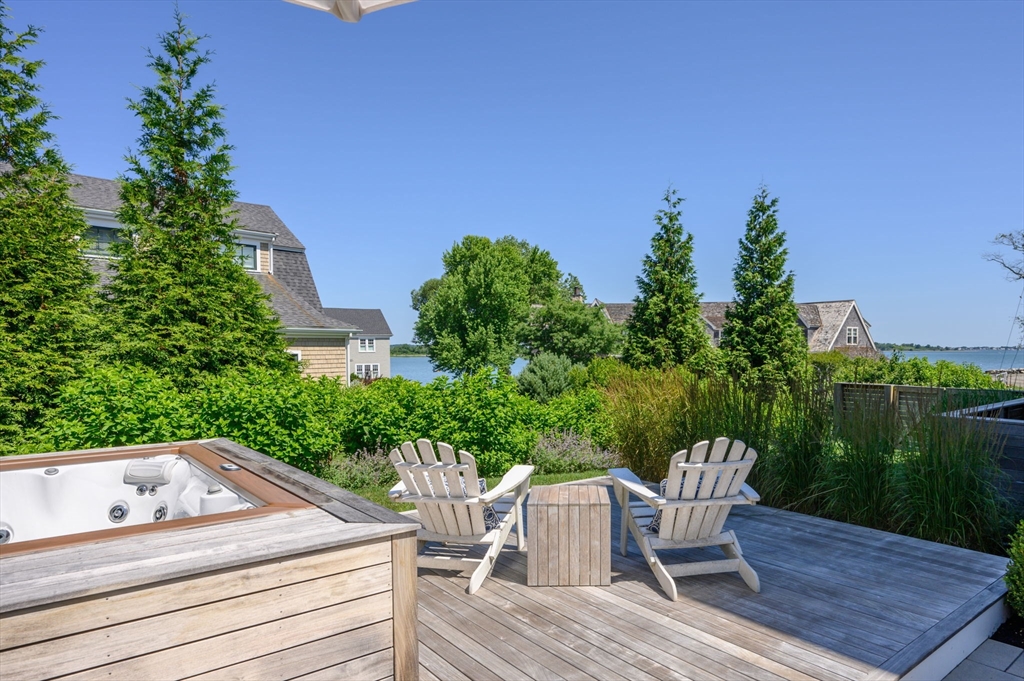 34 Highview Drive Hingham, MA 02043 - Photo 36 of 40 a view of a chairs and table on the deck