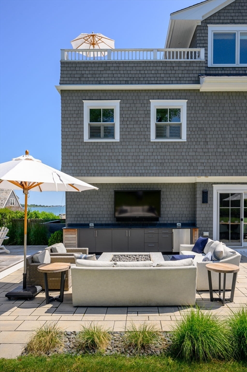 34 Highview Drive Hingham, MA 02043 - Photo 38 of 40 a view of a house with a yard and sitting area
