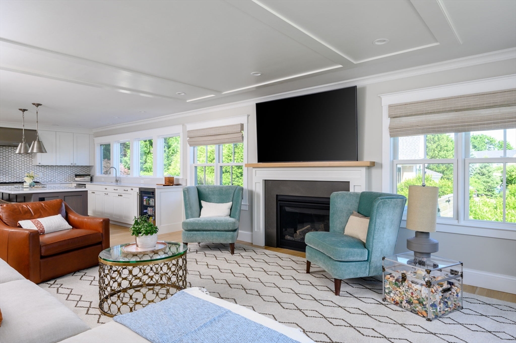 34 Highview Drive Hingham, MA 02043 - Photo 7 of 40 a living room with furniture a fireplace and a flat screen tv