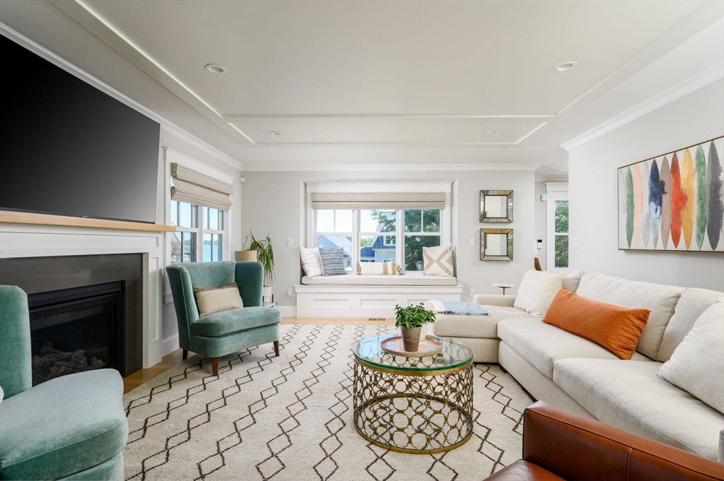 34 Highview Drive Hingham, MA 02043 - Photo 8 of 40 a living room with furniture and a fireplace