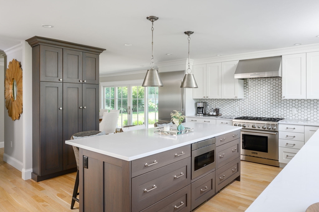 34 Highview Drive Hingham, MA 02043 - Photo 10 of 40 a kitchen with a stove a sink and a wooden floor