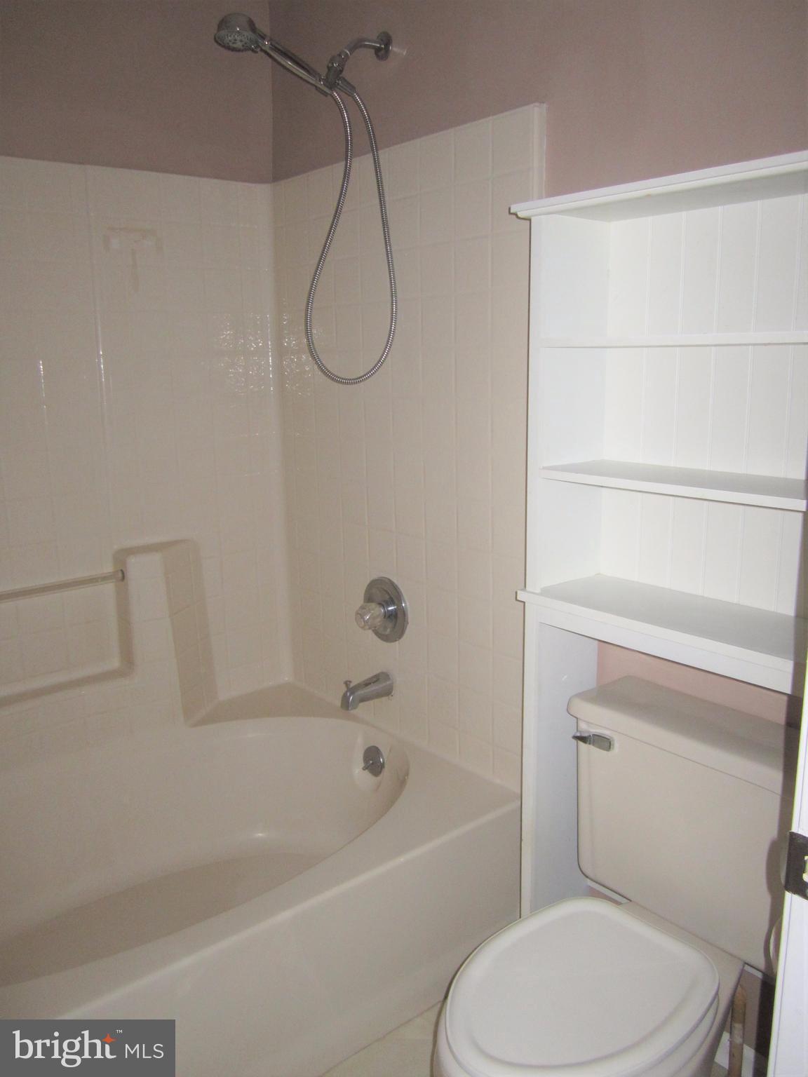 17 Bridle Lane, Unit 72 Baltimore, MD 21236 - Photo 16 of 22 a bathroom with a toilet and a bath tub