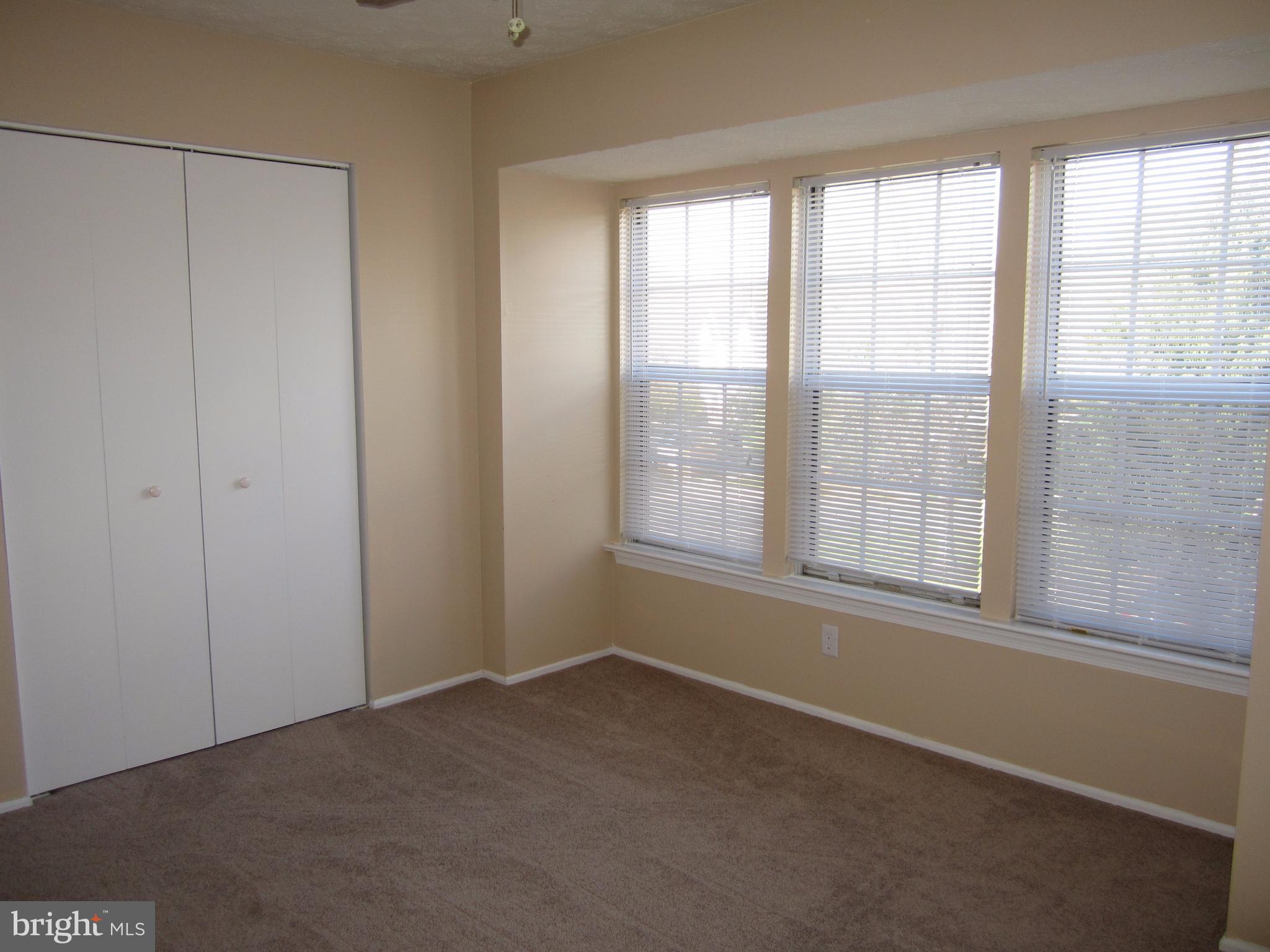 17 Bridle Lane, Unit 72 Baltimore, MD 21236 - Photo 18 of 22 an empty room with windows