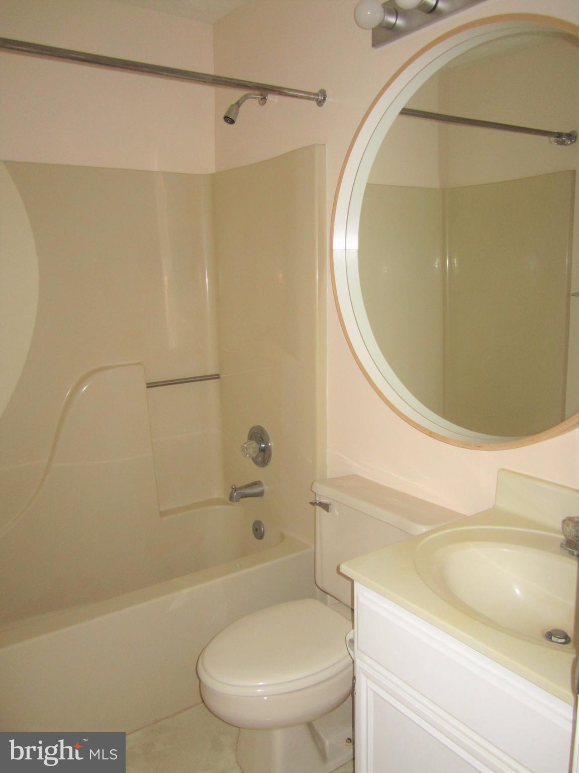 17 Bridle Lane, Unit 72 Baltimore, MD 21236 - Photo 19 of 22 a bathroom with a sink and a mirror